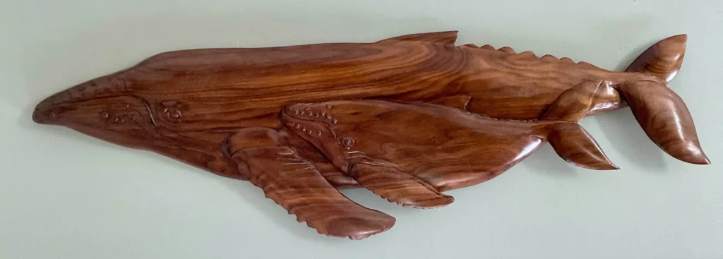 Gary Cota's hand-carved, wood relief of a humpback whale and calf