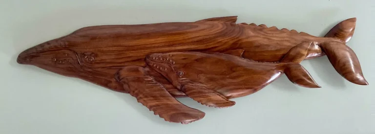 Gary Cota's hand-carved, wood relief of a humpback whale and calf