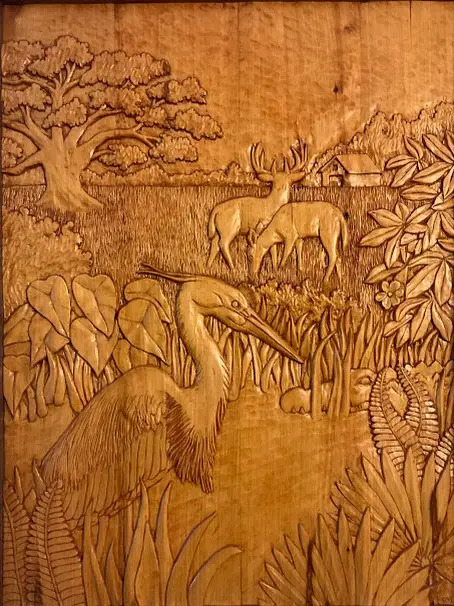 Behind the Farm, original ash wood carving featuring an alligator, deer, and herons in a Louisiana wetland landscape
