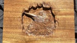 Hand-carved hardwood box featuring a bird fledgling.