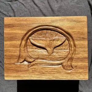 Hand-carved wooden box featuring a whale tail design.
