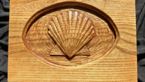 Hand-carved oak box featuring a raised scallop shell design.
