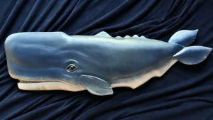 Hand-carved blue-gray whale sculpture designed for outdoor display.
